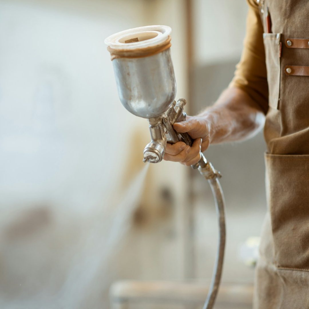 a person paint spraying